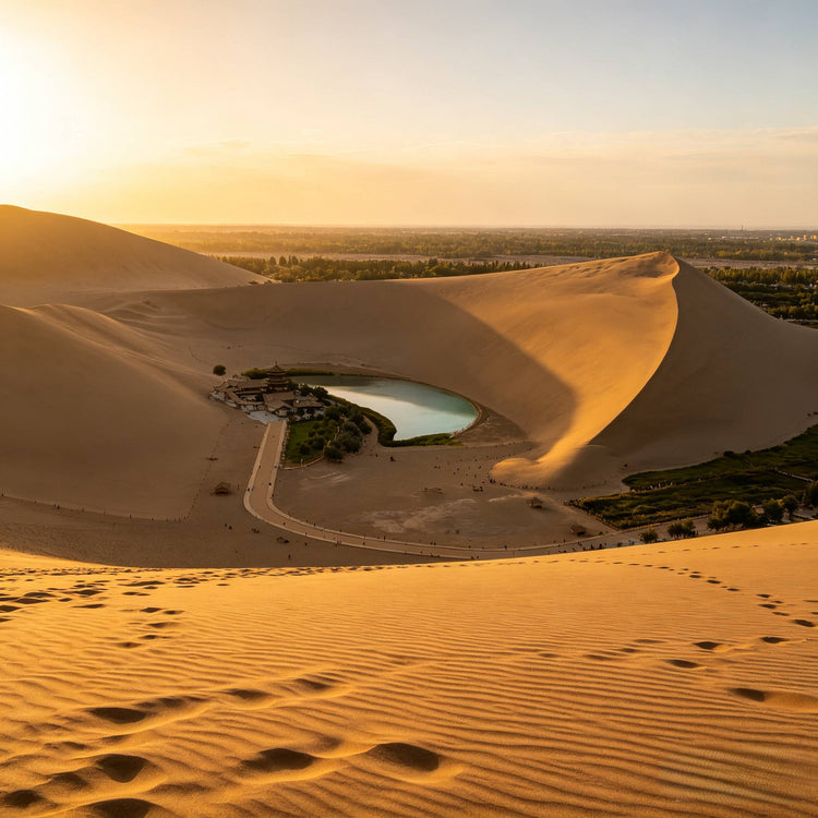 Mingsha Mountain and Crescent Spring in desert at golden sunset, Dunhuang