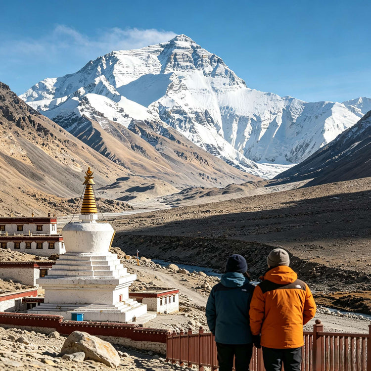 Everest view from Rongbuk Monastery with stupa and two travelers, Tibet