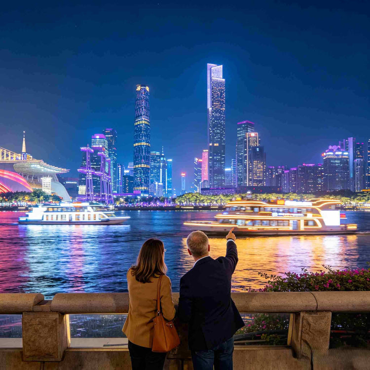 Western couple viewing the illuminated Pearl River and Guangzhou skyline at night