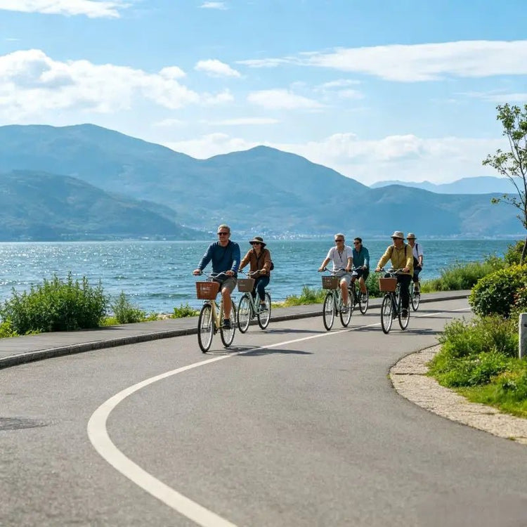 Western tourists cycling along Erhai Lake Ecological Corridor, Dali