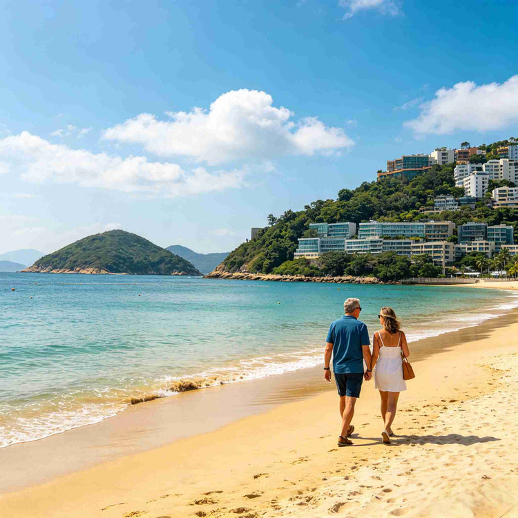 Couple walking along the golden sandy beach of Repulse Bay on a sunny day in Hong Kong