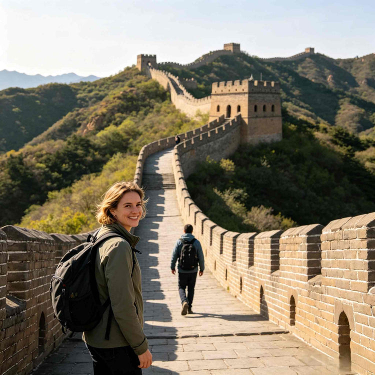 Western female tourist with backpack hiking on the restored Great Wall section