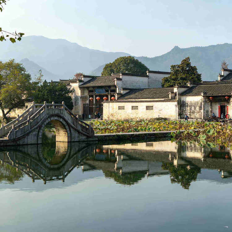 Hongcun Ancient Village South Lake with stone arch bridge