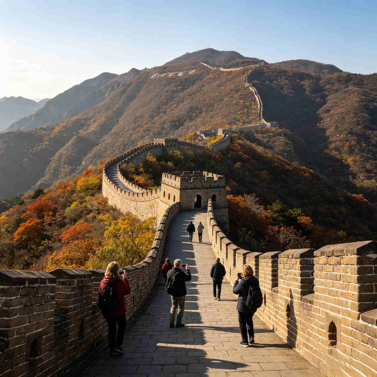 Visitors walking along the Mutianyu Great Wall with mountain scenery in autumn