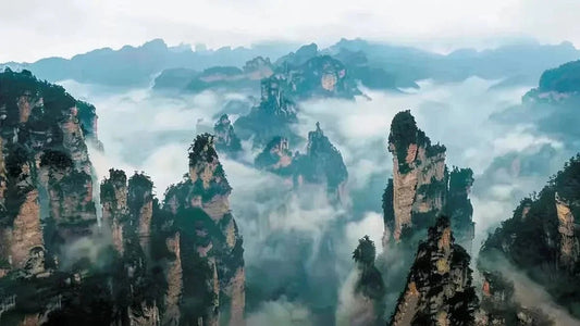 Zhangjiajie quartz sandstone peaks in morning mist, iconic scenic travel destination