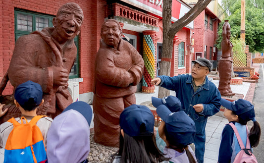 Teenagers exploring Chinese cultural heritage during educational study tour