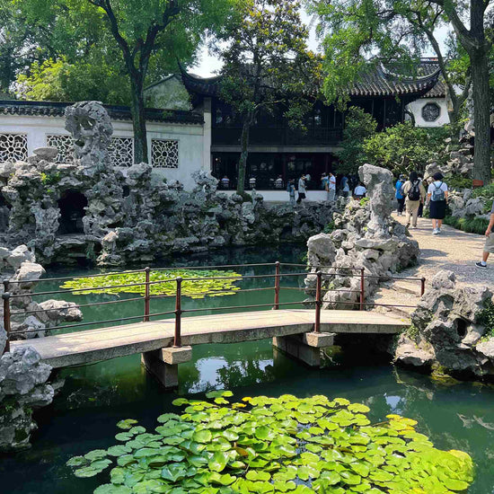 Travelers visiting the UNESCO-listed Humble Administrator's Garden, classical Suzhou garden private tour