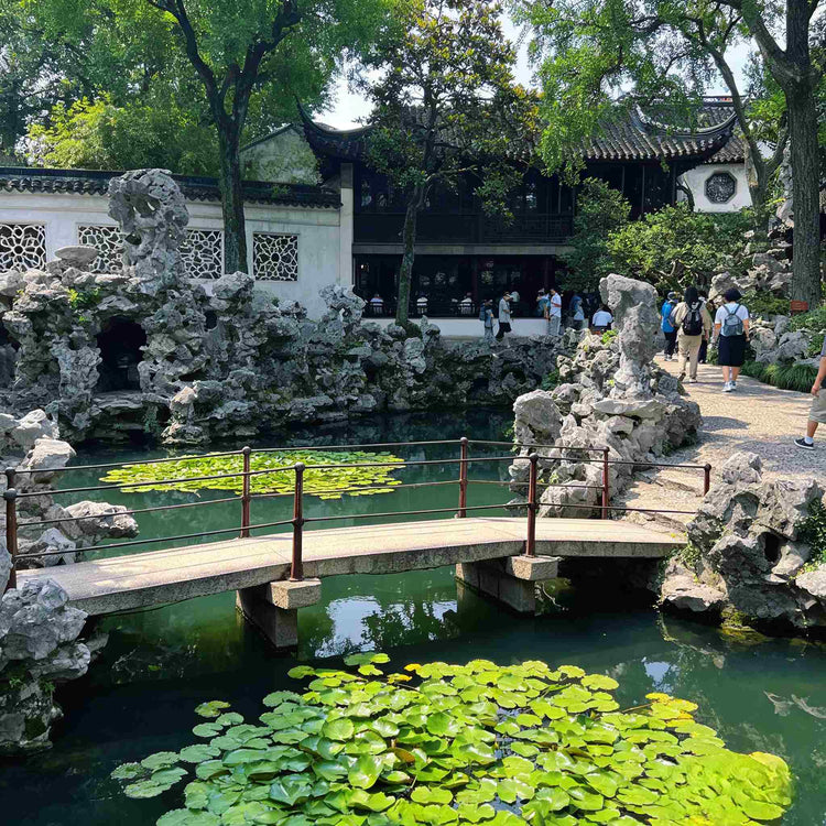Travelers visiting the UNESCO-listed Humble Administrator's Garden, classical Suzhou garden private tour
