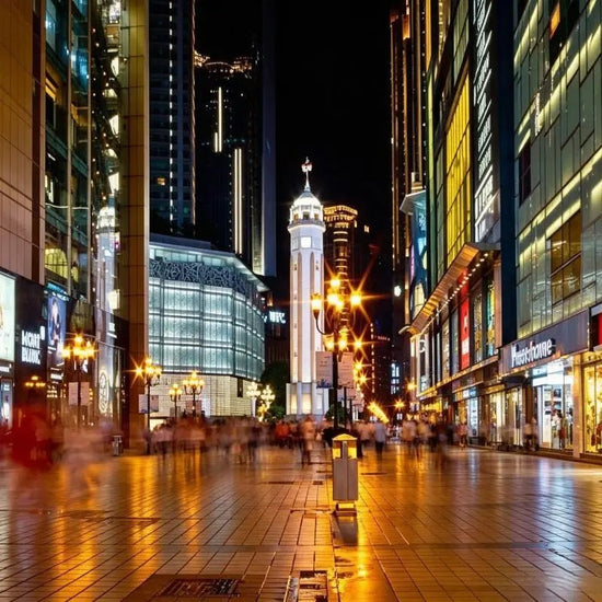 Jiefangbei Monument Chongqing CBD skyline, historic monument with modern skyscrapers and night lights, China inbound travel attraction