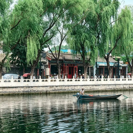 Shichahai lake view in Beijing, weeping willows and traditional old Beijing hutong buildings