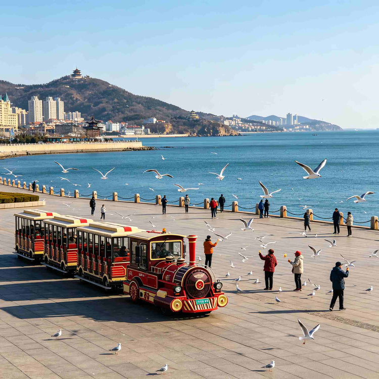 Sightseeing train at Xinghai Square with seagulls, Dalian coastal landmark