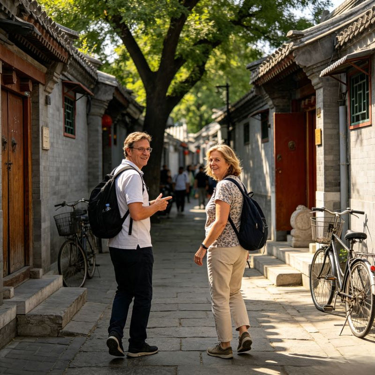 Two western tourists walking through authentic Beijing hutong alley, old neighborhood private walking tour