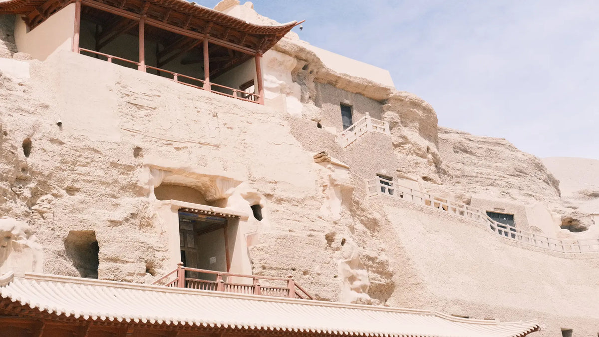 Mogao Caves cliffside cave temples, ancient Buddhist grottoes carved into sandstone cliffs in Dunhuang, China