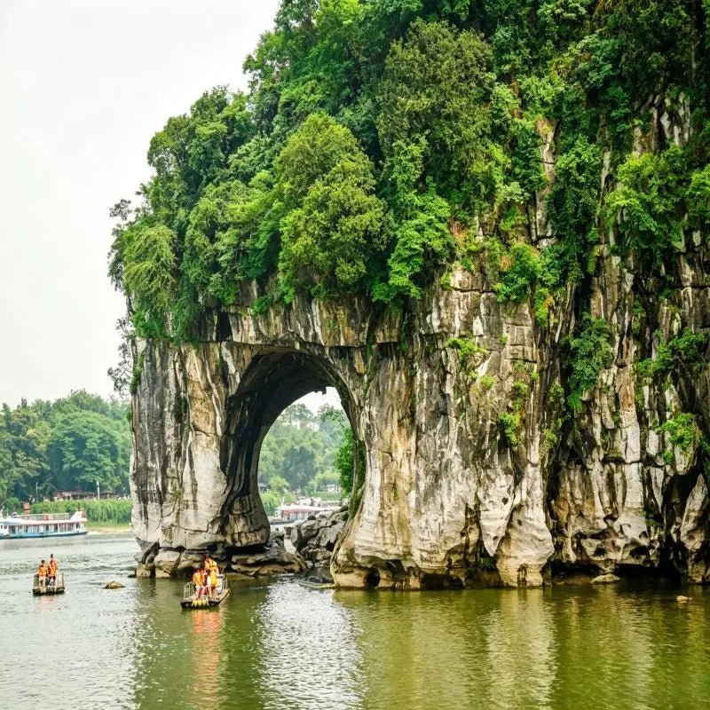 Elephant Trunk Hill scenic area on Li River in Guilin Guangxi China, iconic karst natural arch landmark with tourist boats on the water