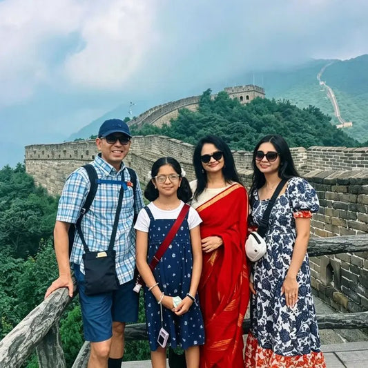 Family travelers posing at Mutianyu Great Wall on a private Beijing family tour