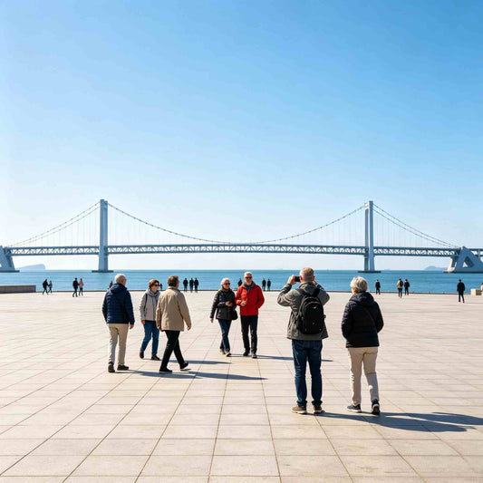 Group of western tourists walking on Xinghai Square with Xinghai Bay Bridge in background, Dalian China