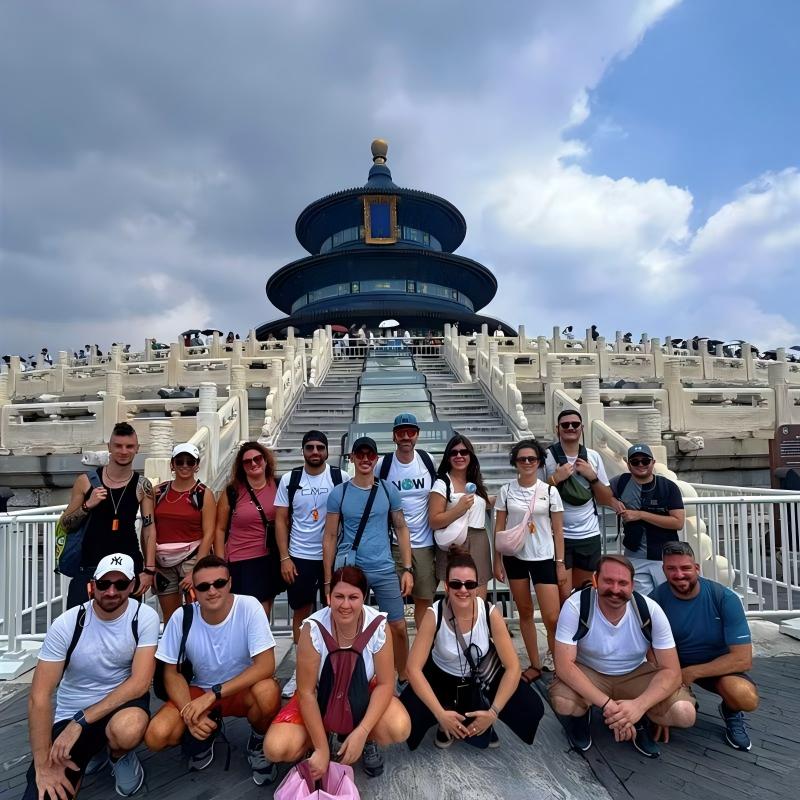Group of international travelers posing at the Temple of Heaven in Beijing on a private custom China tour
