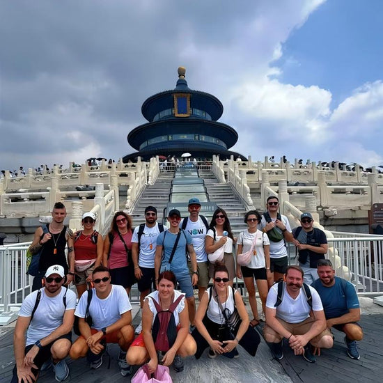 Group of international travelers posing at the Temple of Heaven in Beijing on a private custom China tour