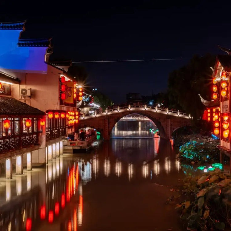 Jiangnan water town night stone bridge red lanterns canal reflection private tour
