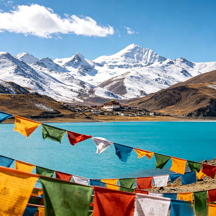 Turquoise Yamdrok Lake with colorful prayer flags and Himalayan snow mountains, Tibet