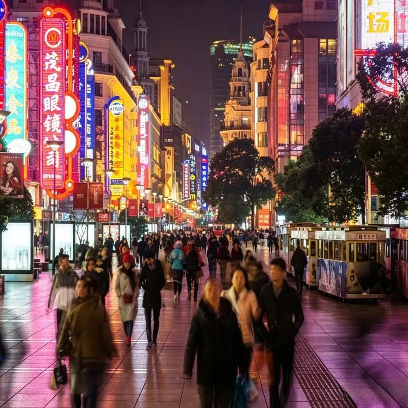 Nanjing Road Pedestrian Street Shanghai, century-old iconic shopping boulevard with historic architecture, neon night lights and bustling downtown commercial street, China inbound travel attraction
