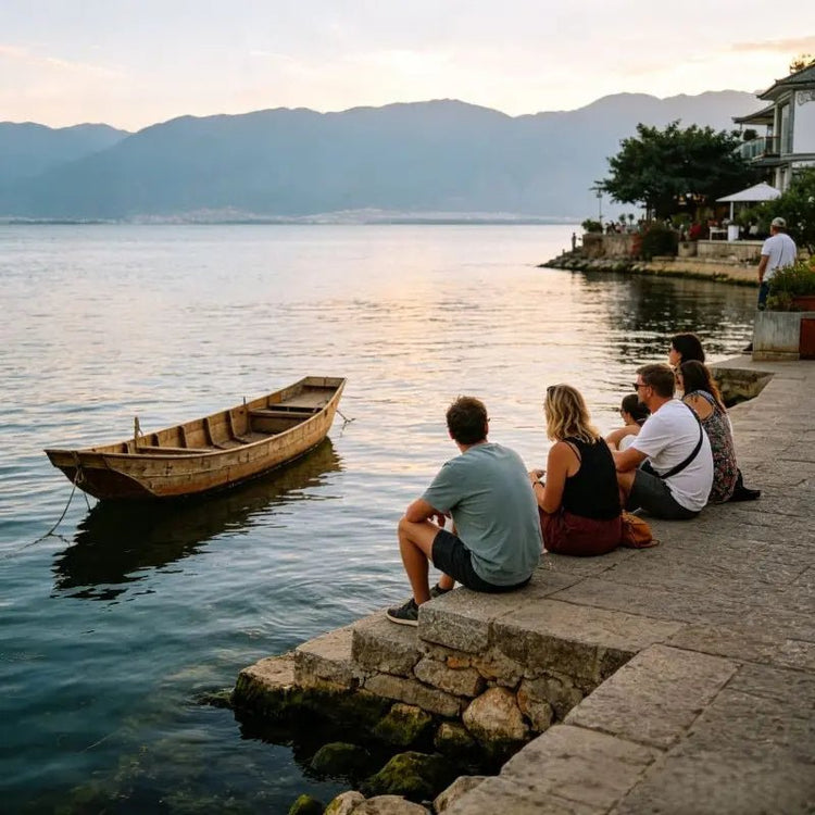 Tourists relaxing by Erhai Lake with wooden fishing boat, Shuanglang Dali