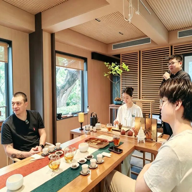 Group tea tasting session with English-speaking tea master in Beijing hutong tea house
