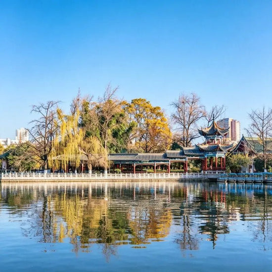 Cuihu Green Lake Park Kunming, lakeside Chinese pavilion with water reflection, Yunnan China city park scenery