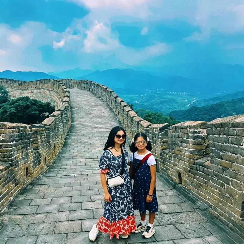 Mother and daughter posing on Mutianyu Great Wall on a private Beijing family tour