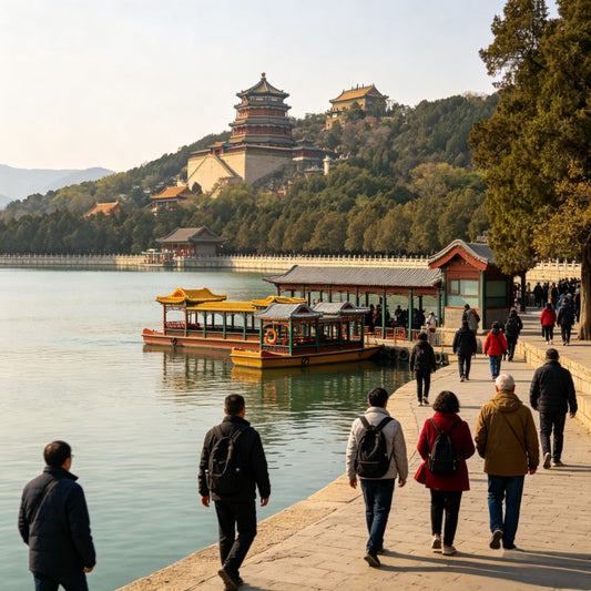 Tourists walking along Kunming Lake waterfront at the Summer Palace, with Longevity Hill and historic imperial architecture, UNESCO World Heritage Site in Beijing