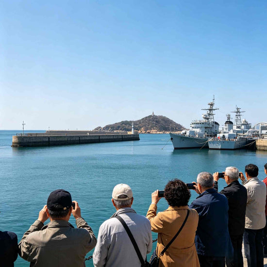 Tourists viewing naval vessels at Lüshun Naval Port Park waterfront, Dalian
