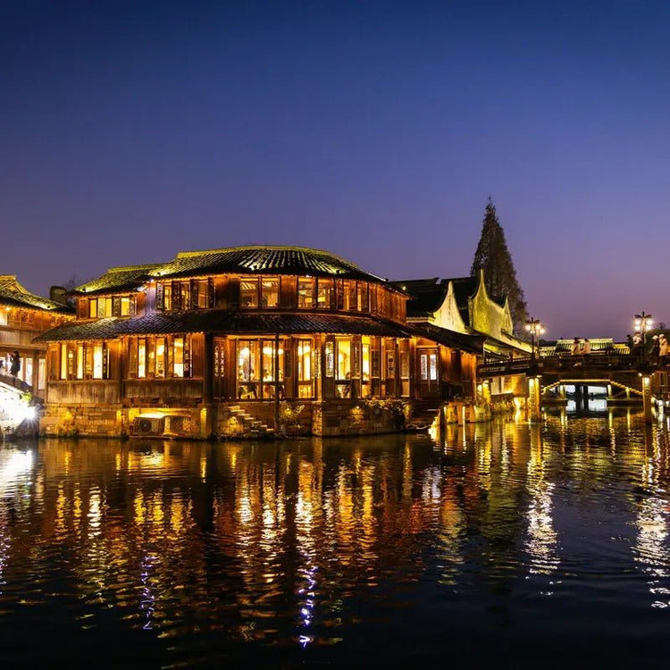 Wuzhen ancient town night canal wooden houses reflection private tour
