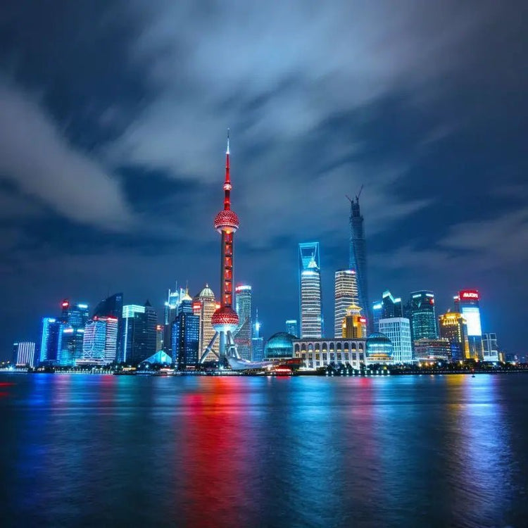 The Bund at night, Pudong skyline and Oriental Pearl Tower across Huangpu River, Shanghai, China
