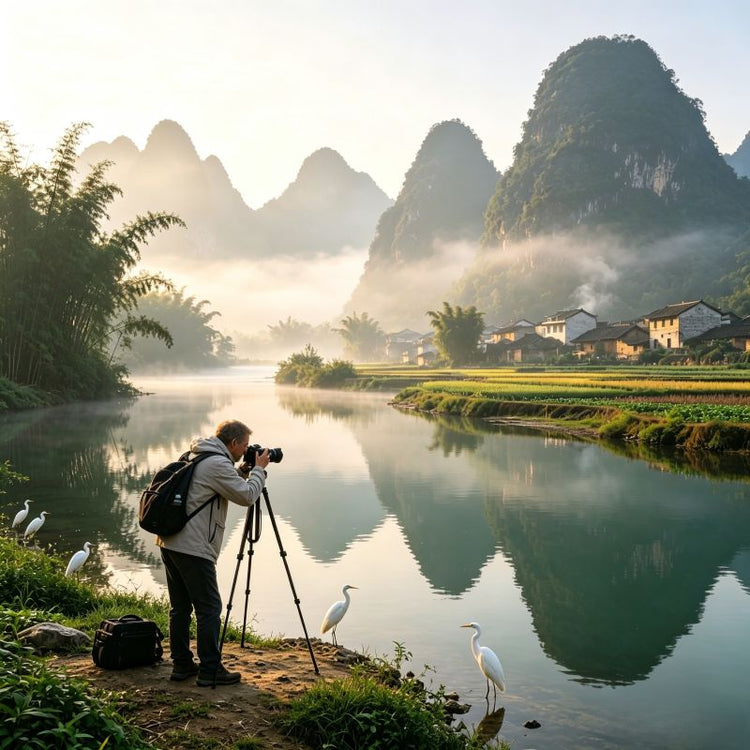 Western travelers photographing karst landscape along Yulong River with misty mountain reflections, Yangshuo, Guilin, China