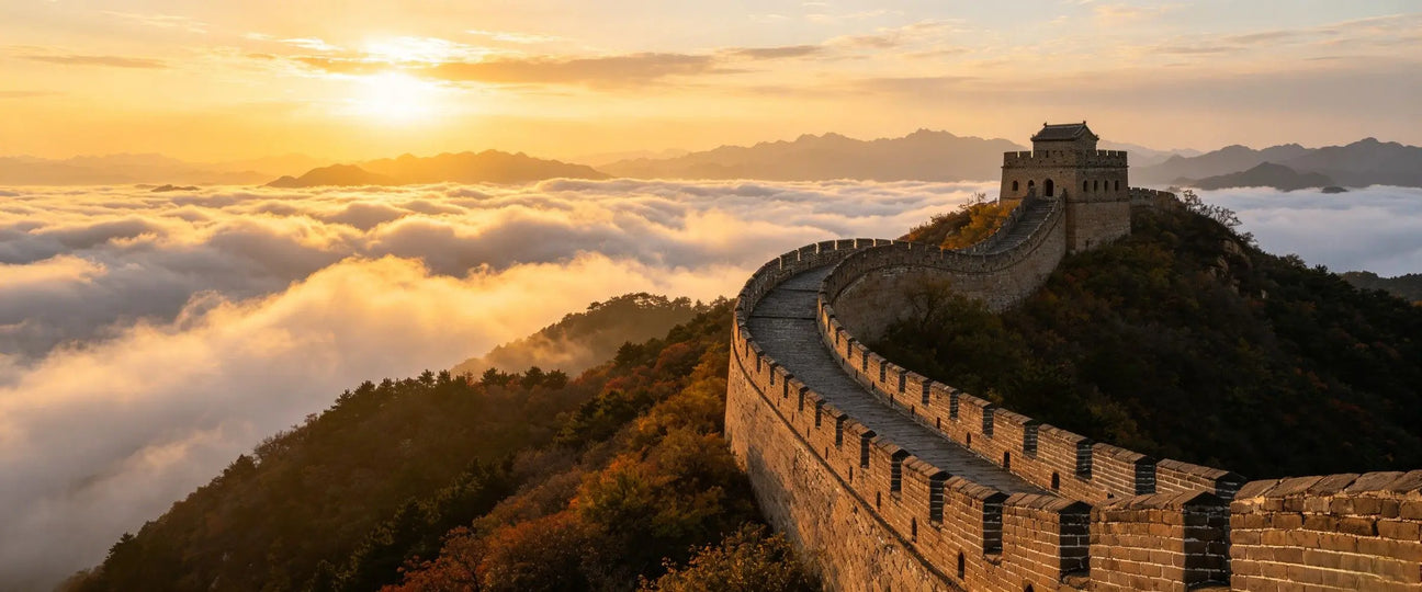 Great Wall of China at golden sunrise above a sea of clouds, private custom China travel hero banner