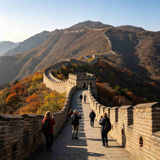 Visitors walking along the Mutianyu Great Wall with mountain scenery in autumn