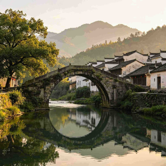 Ancient stone arch bridge over river in Huizhou water town